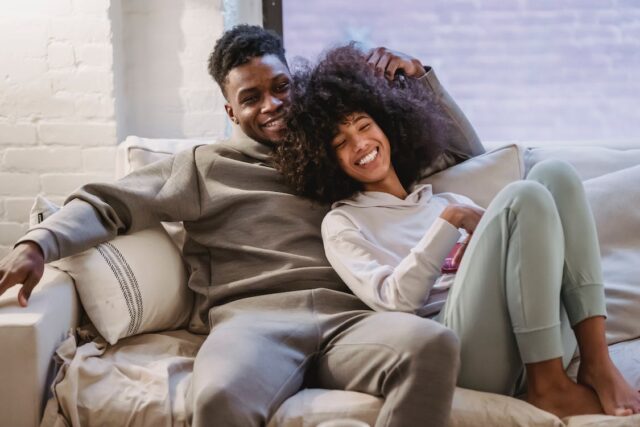 Couple on a Couch. Depiction of a Successful second hand furniture buying