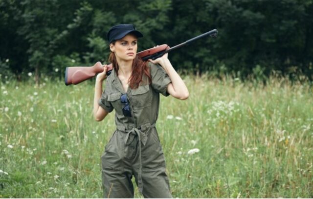 woman with hunting rifle